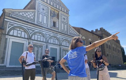 A group gathers in front of the San Miniato al Monte church in Florence, Italy