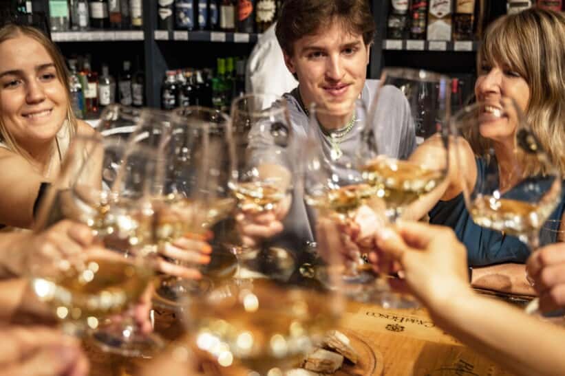 A group cheers during a wine tasting in Florence, Italy