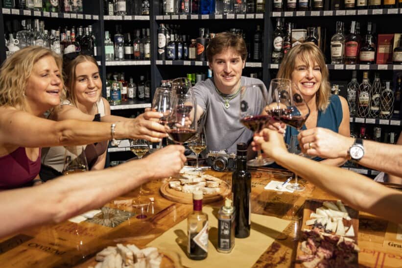A group cheers during a wine tasting in Florence, Italy