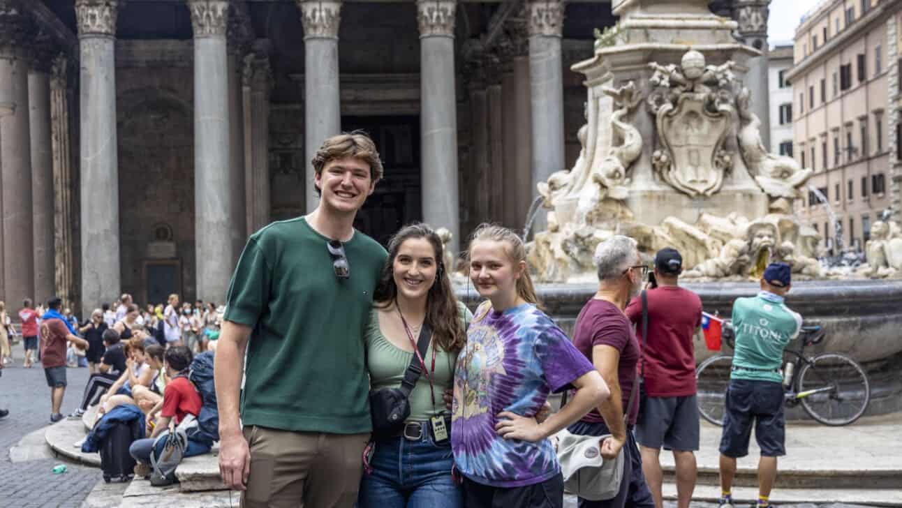 A group of friends poses for a photo in front of the Pantheon in Rome, Italy