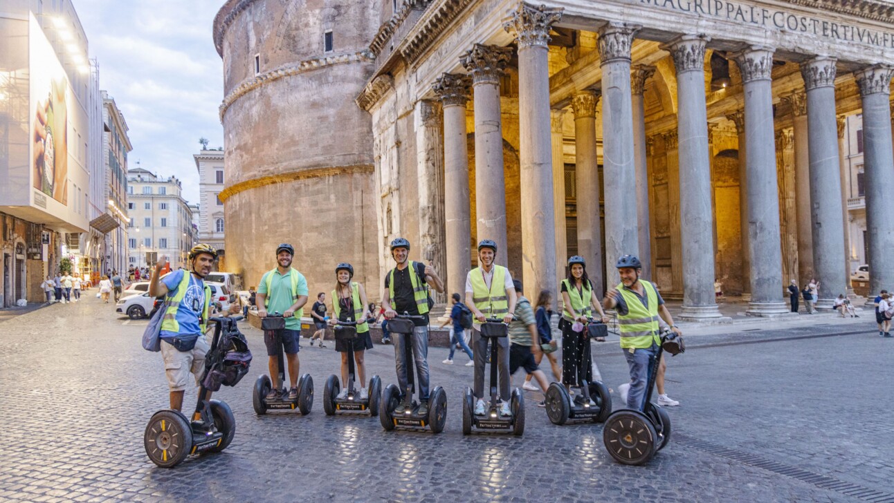 A group of Segwayers pose for a photo in front of the Pantheon in Rome, Italy