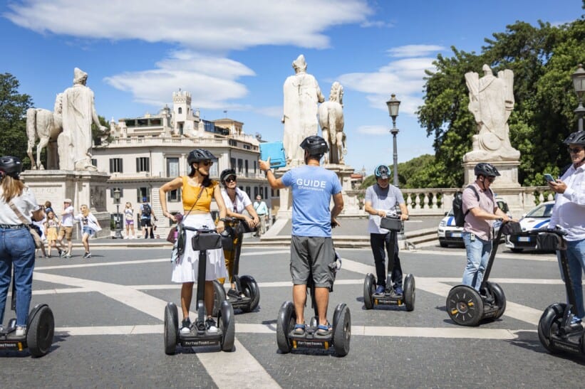 A group rides Segways through central Rome