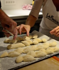 Cutting the dough to form a stylized baguette
