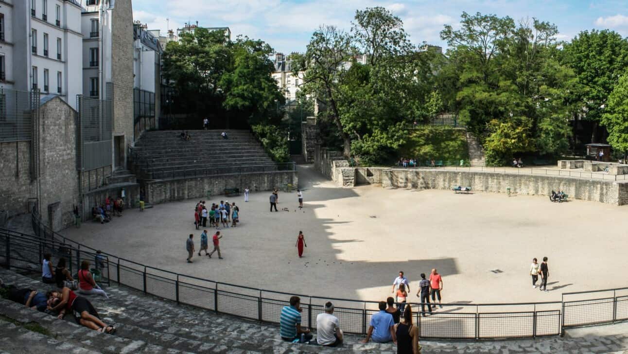 People playing petanque in the arene de luteces in Paris, France