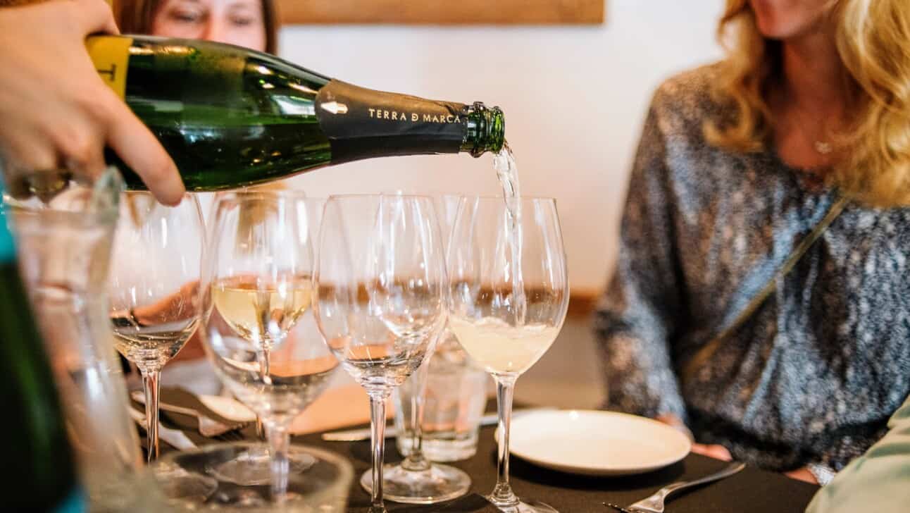 Champagne being poured at a table in Paris, France