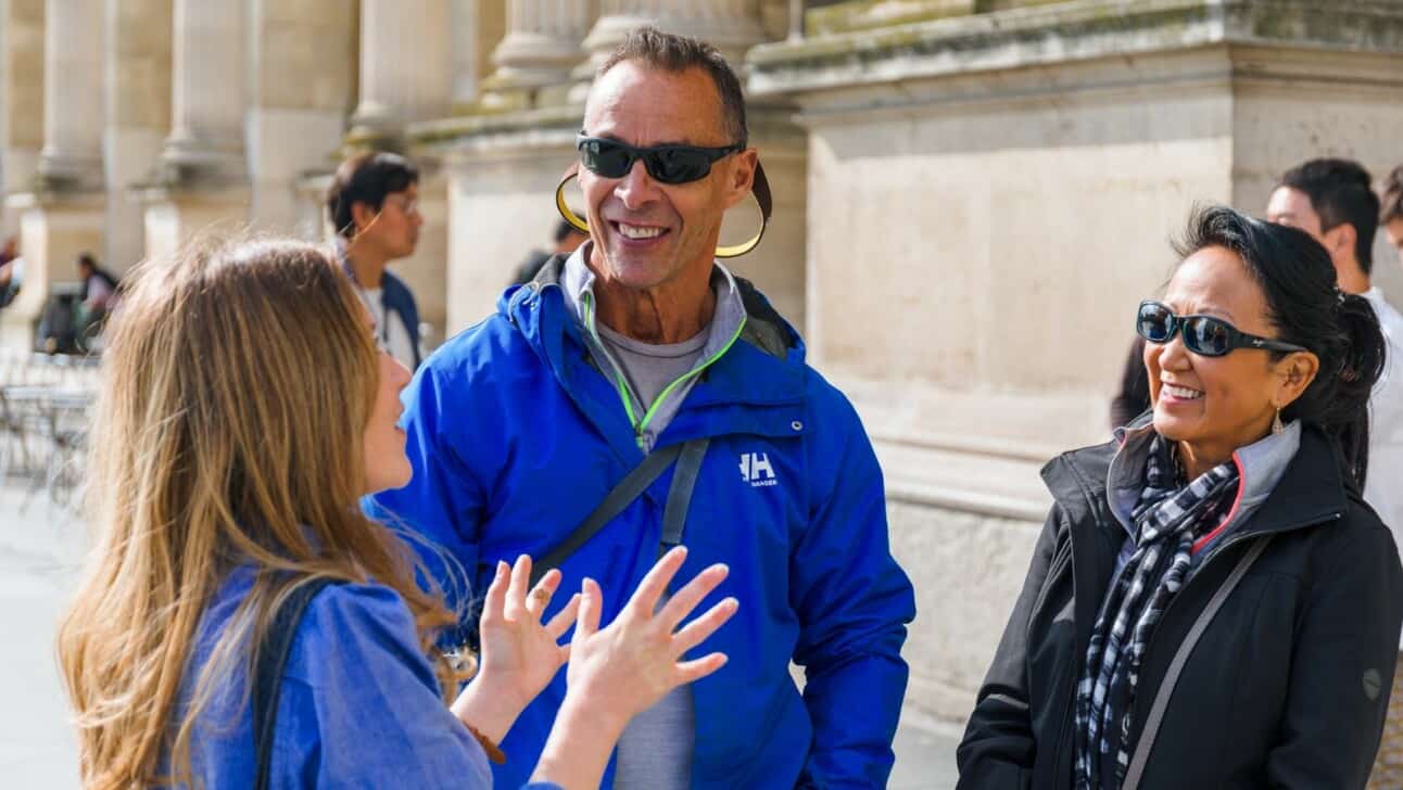 A guide explaining the area to a couple