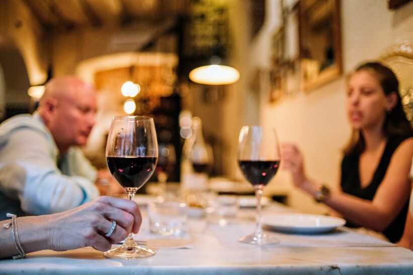 2 glasses of red wine at a table