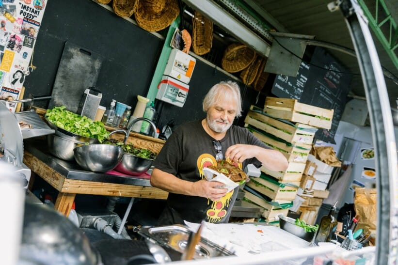 A man makes a savoury crèpe in Paris, France