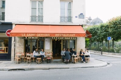 The oustide of a typical corner café in Paris, France
