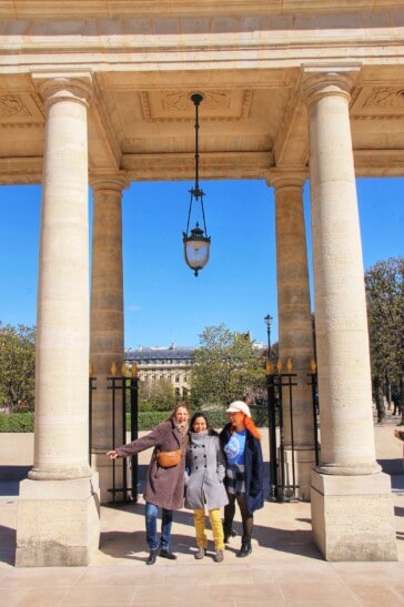 3 friends pose for a photo in Palais Royal