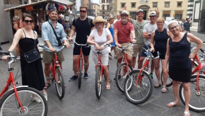A group of cyclists pose with their bikes in Florence, Italy