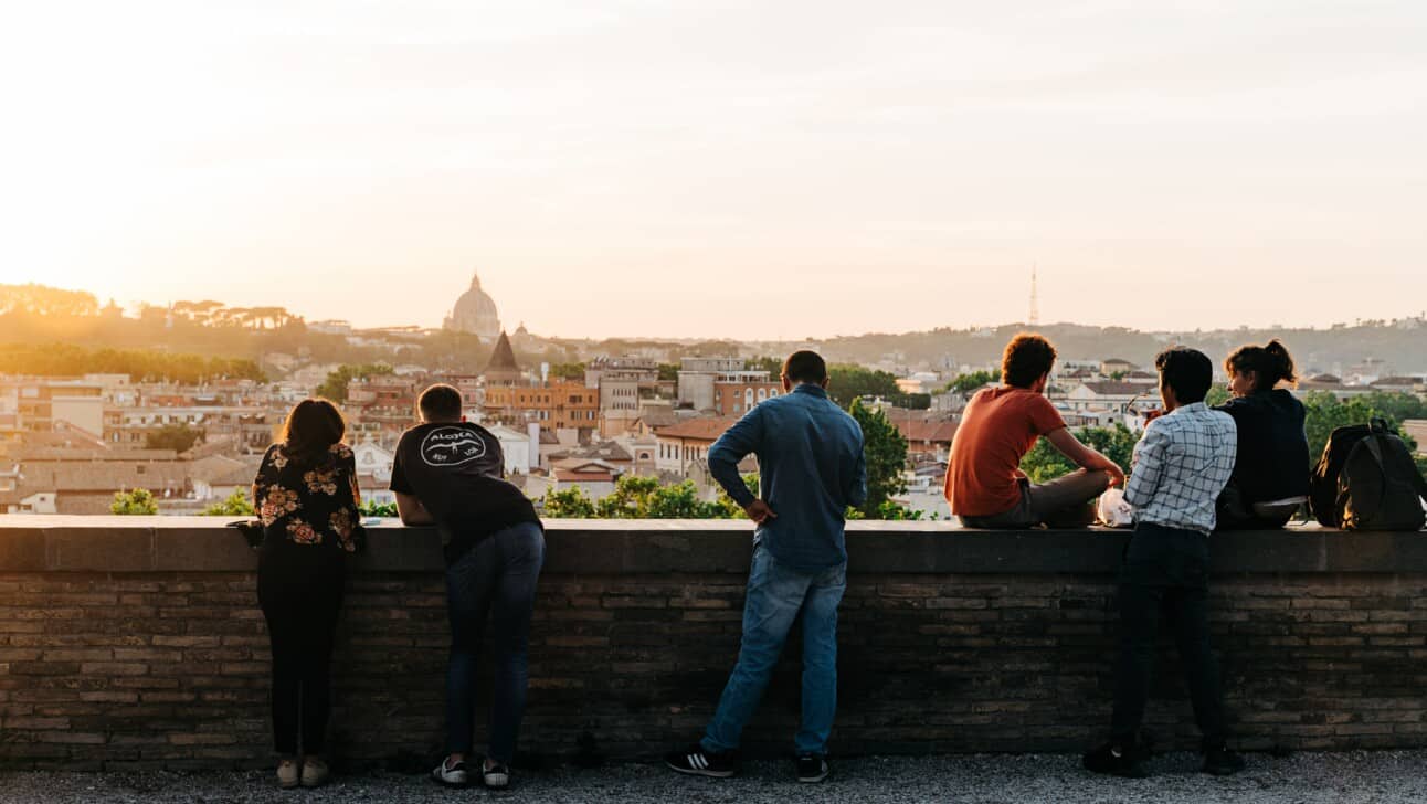 People enjoying the sunset at Giardino degli Aranci in Rome, Italy