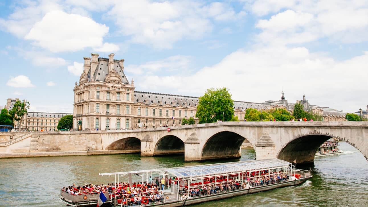 The Louvre Museum as seen from the Seine river in Paris, France