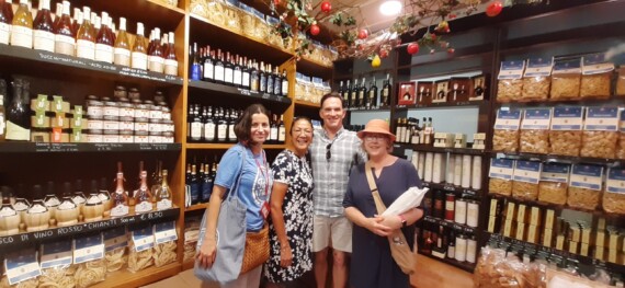 A group of four in an Italian food shop.