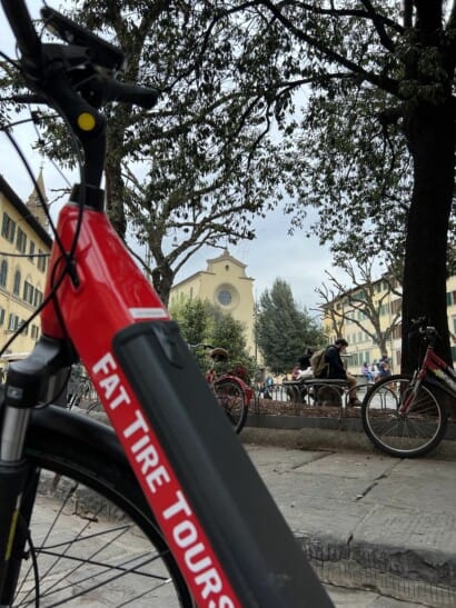 A red, electric bike parked in Florence, Italy