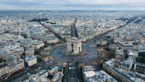 The Arc de Triomphe from the view of a drone and the multiple avenues that jut out from it
