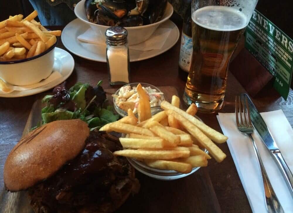 A burger, fries, and a beer for lunch at a London pub