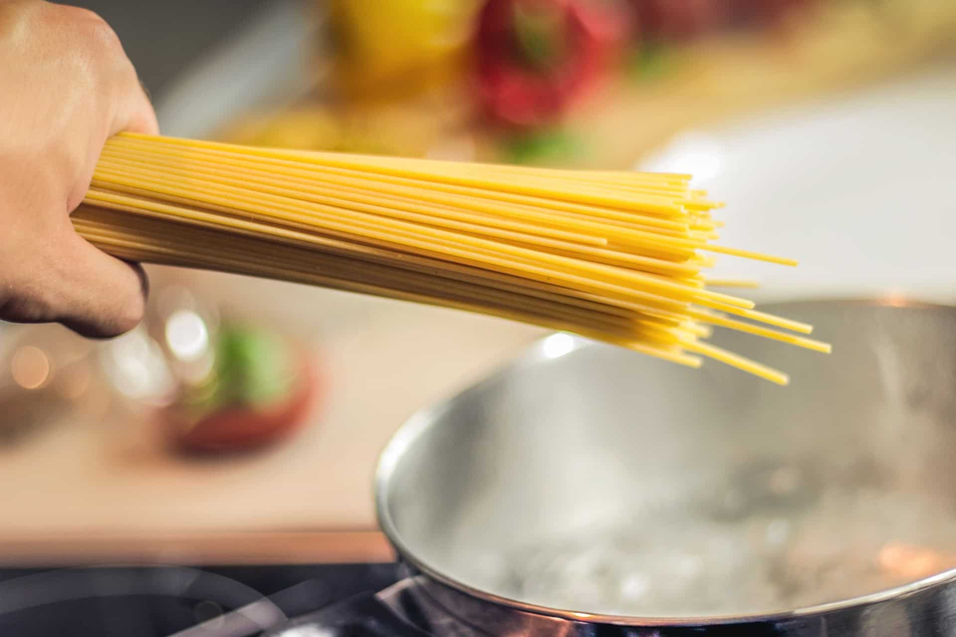 spaghetti getting ready to be put in boiling water