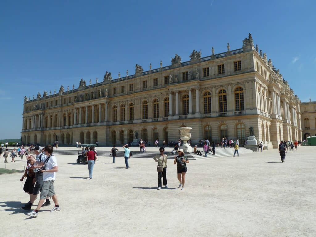 Versailles Palace exterior with visitors outside