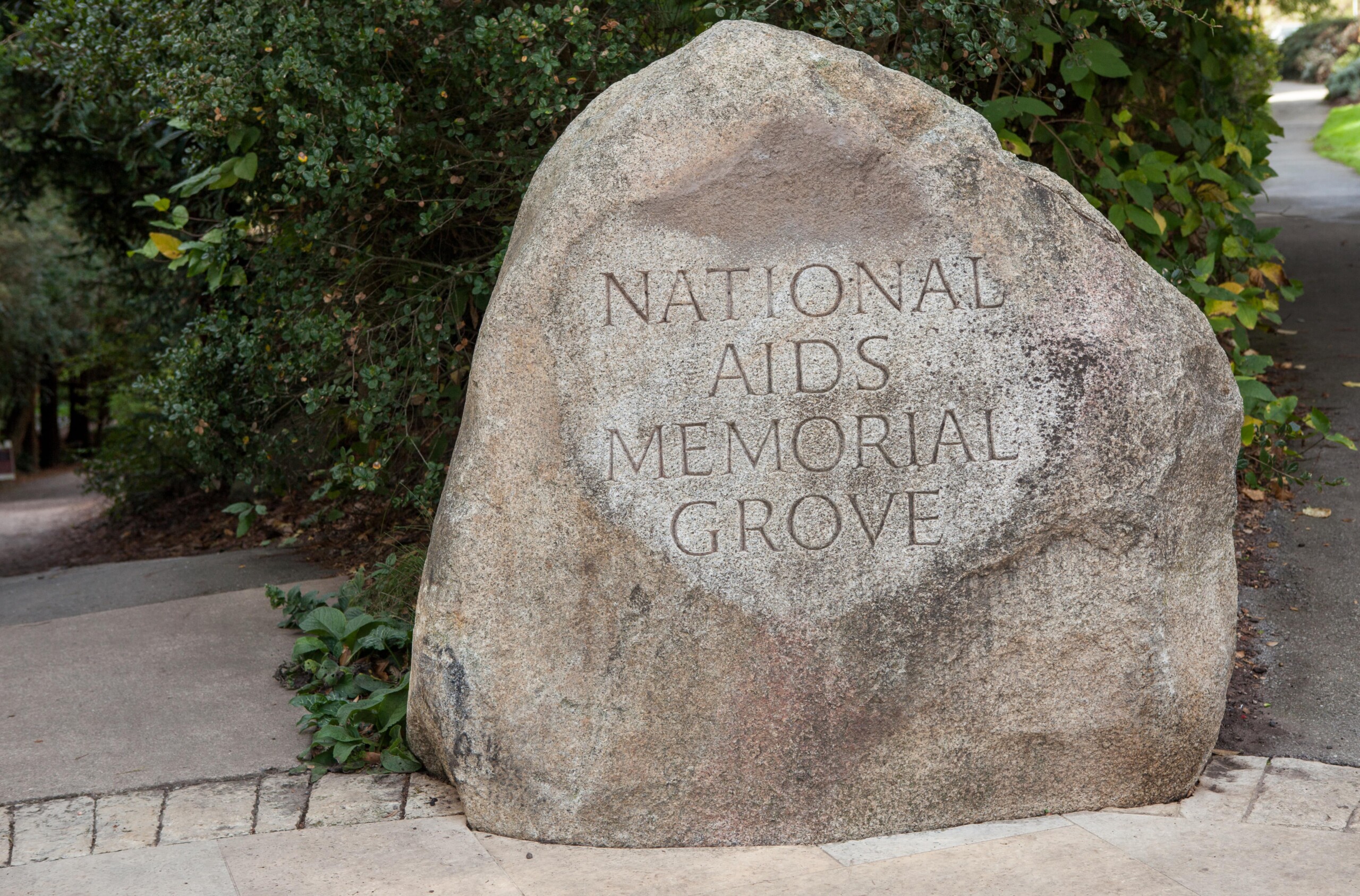An engraved rock at the entrance to the National Aids Memorial Grove in San Francisco