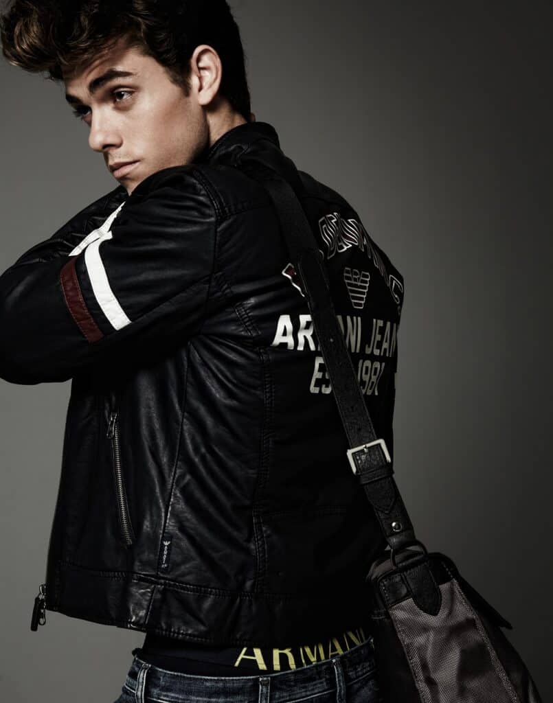 A male model wearing a black and white Armani jacket