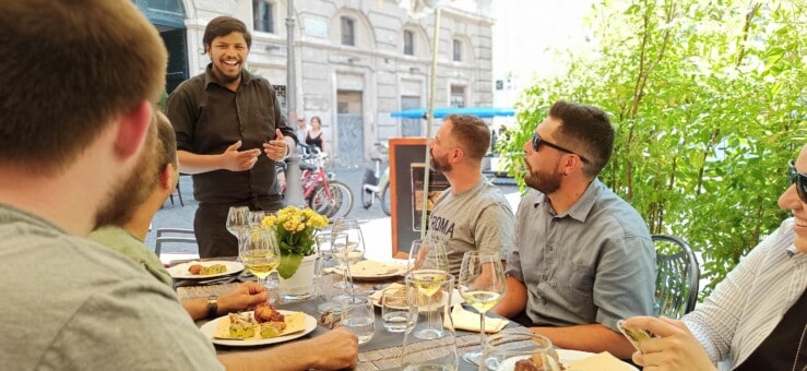 A smiling sommelier in Rome