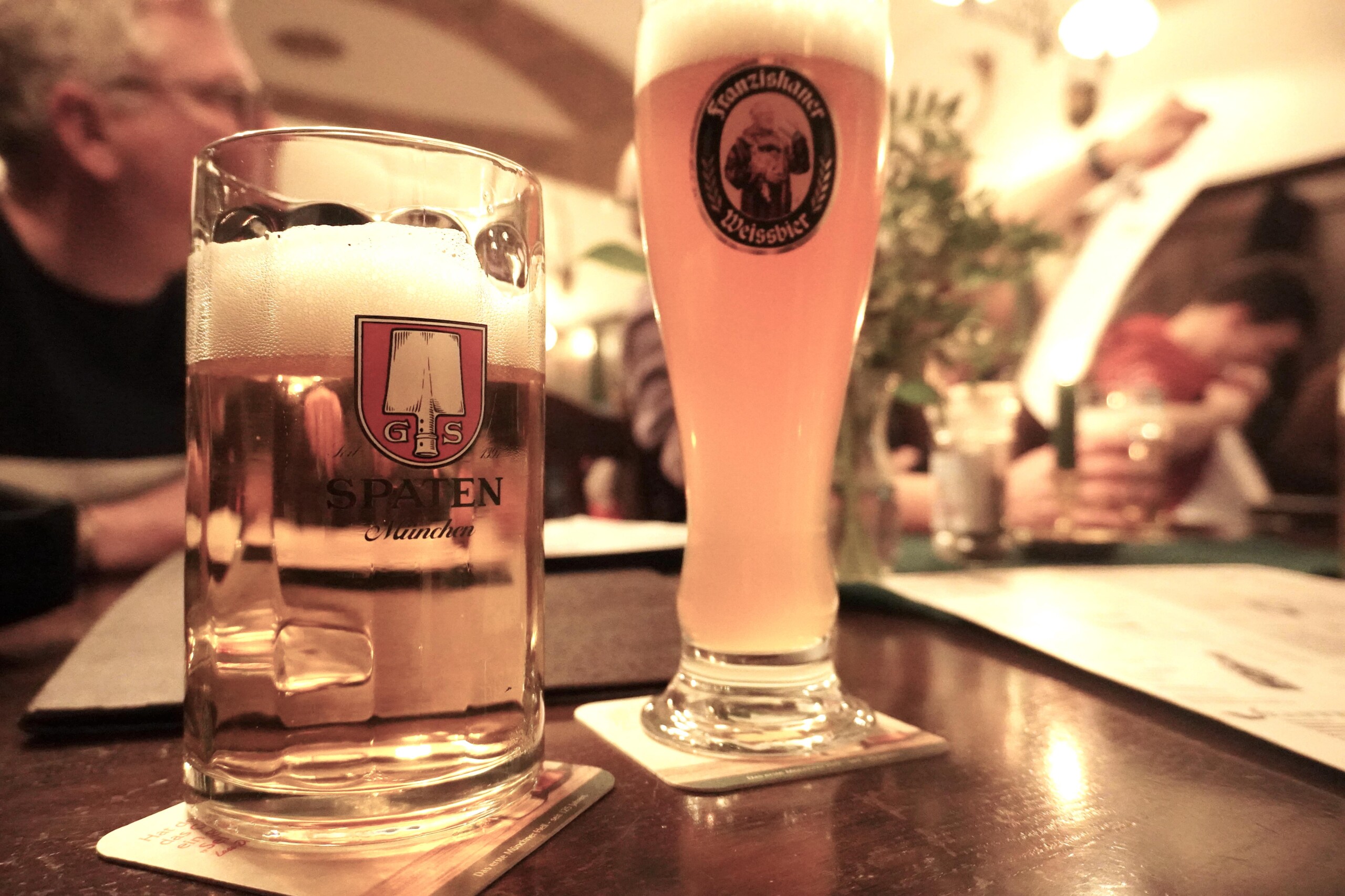 Two pints of different beer at a beer hall in Munich