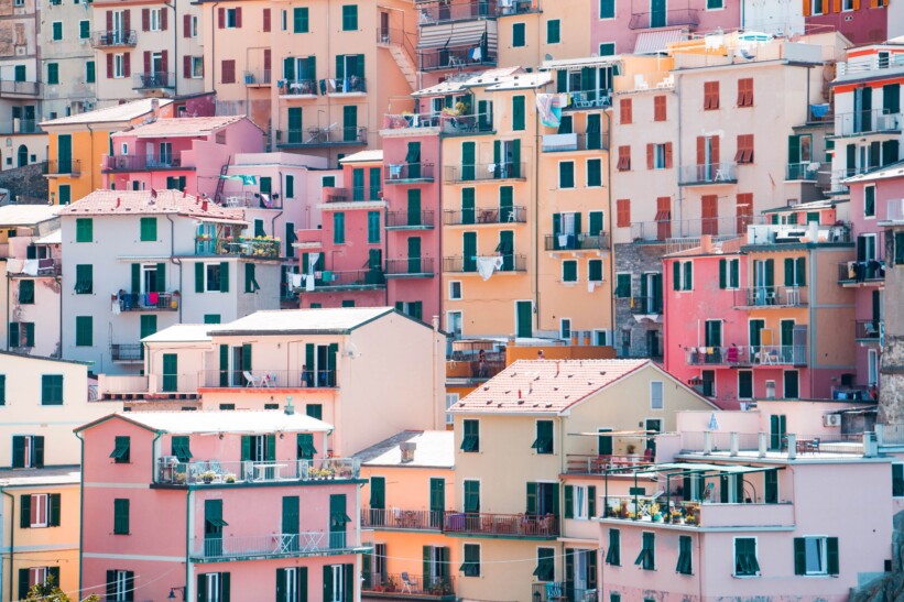Pink, yellow, and orange homes in Cinque Terre, Italy