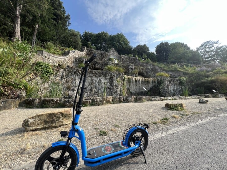 An e-scooter parked in front of a fountain in Florence, Italy