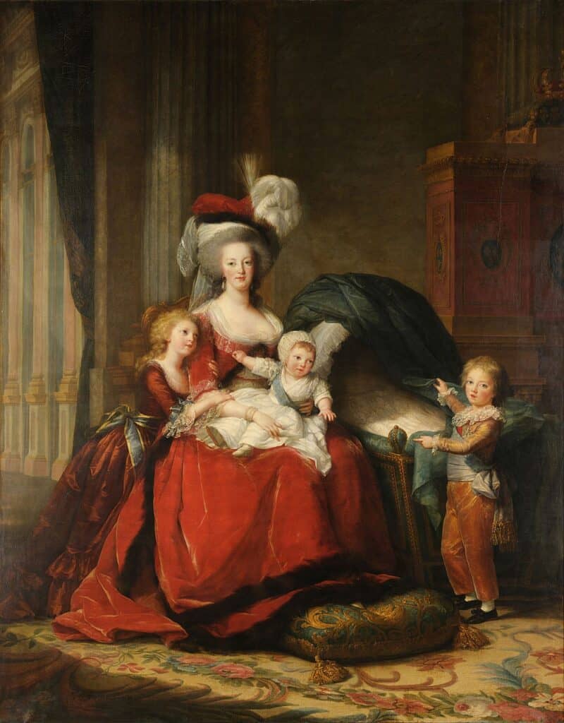 A portrait of Marie Antoinette in a red dress, with a child on her lap, and two other children at her side