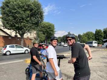 A group of e-scooter riders in Florence, Italy