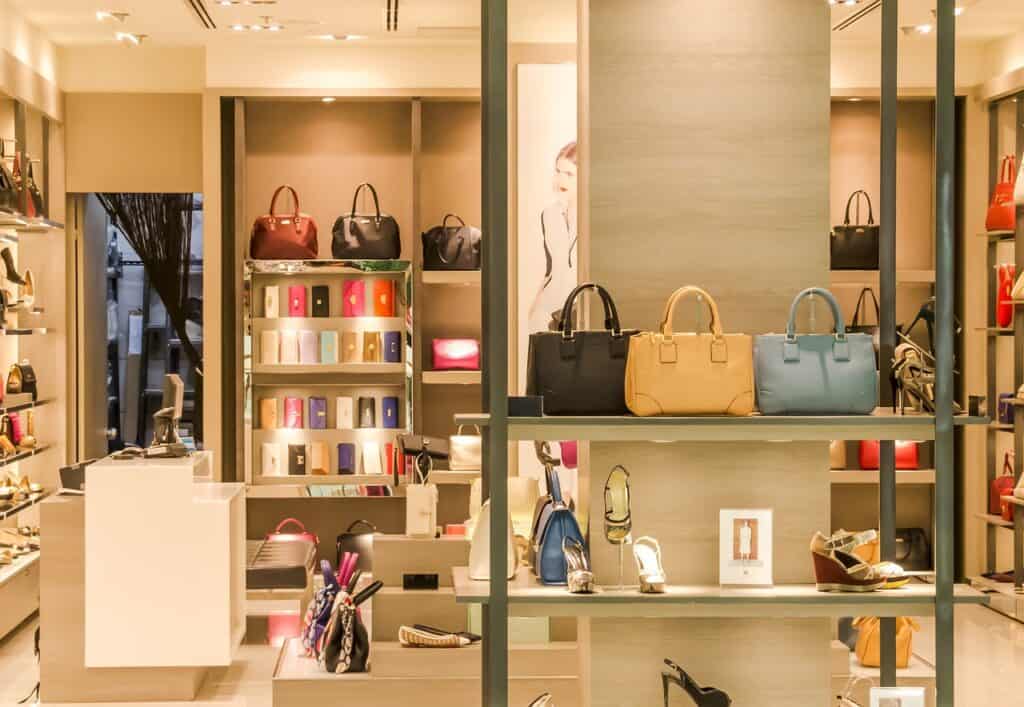 The interior of a department store with purses and shoes on display