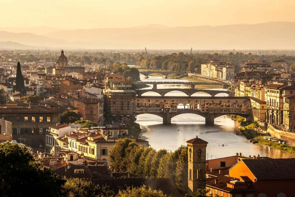 A beautiful image of Florence with the sun setting nearby