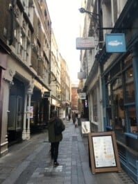 A man walks down Bow Lane in central London