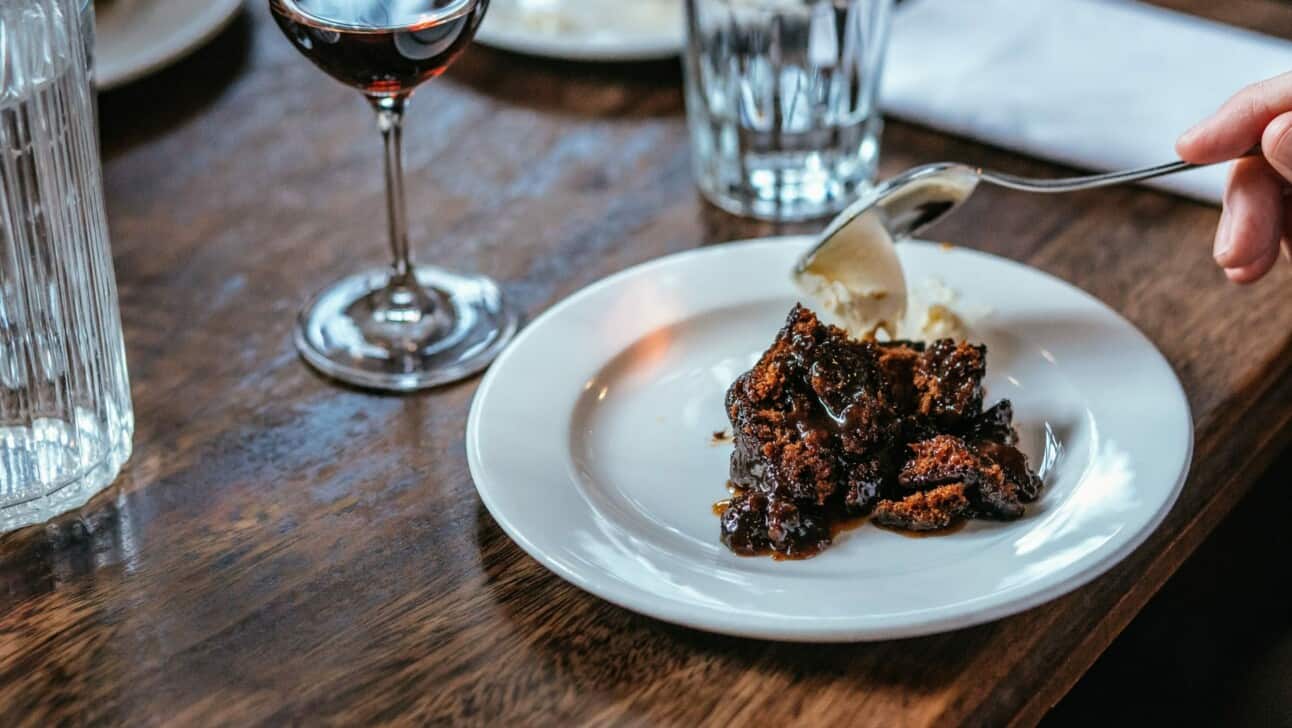 Sticky toffee pudding with cream and wine