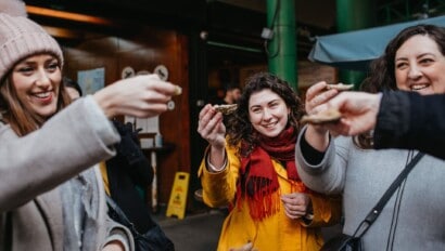 Women cheers their oysters