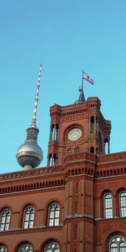 Red Town Hall in Berlin with a blue sky behind 