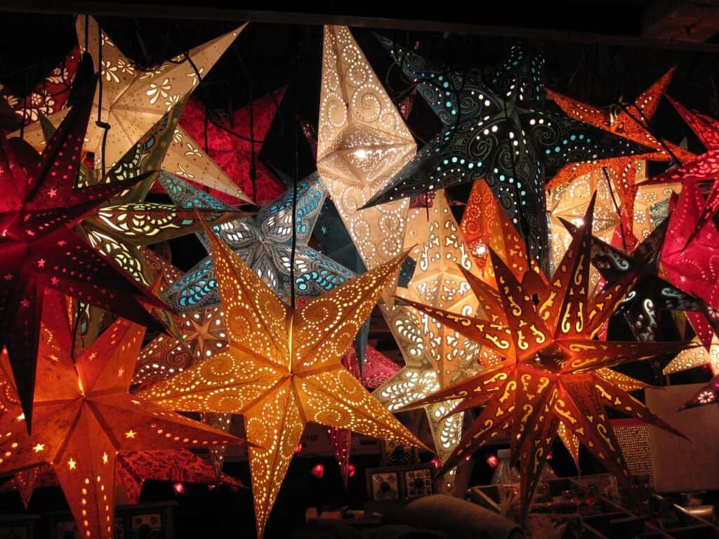 Image of colorful paper stars hanging above