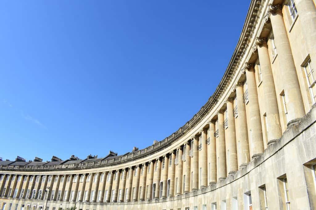 The Royal Crescent in Bath with a bright blue sky on a sunny day