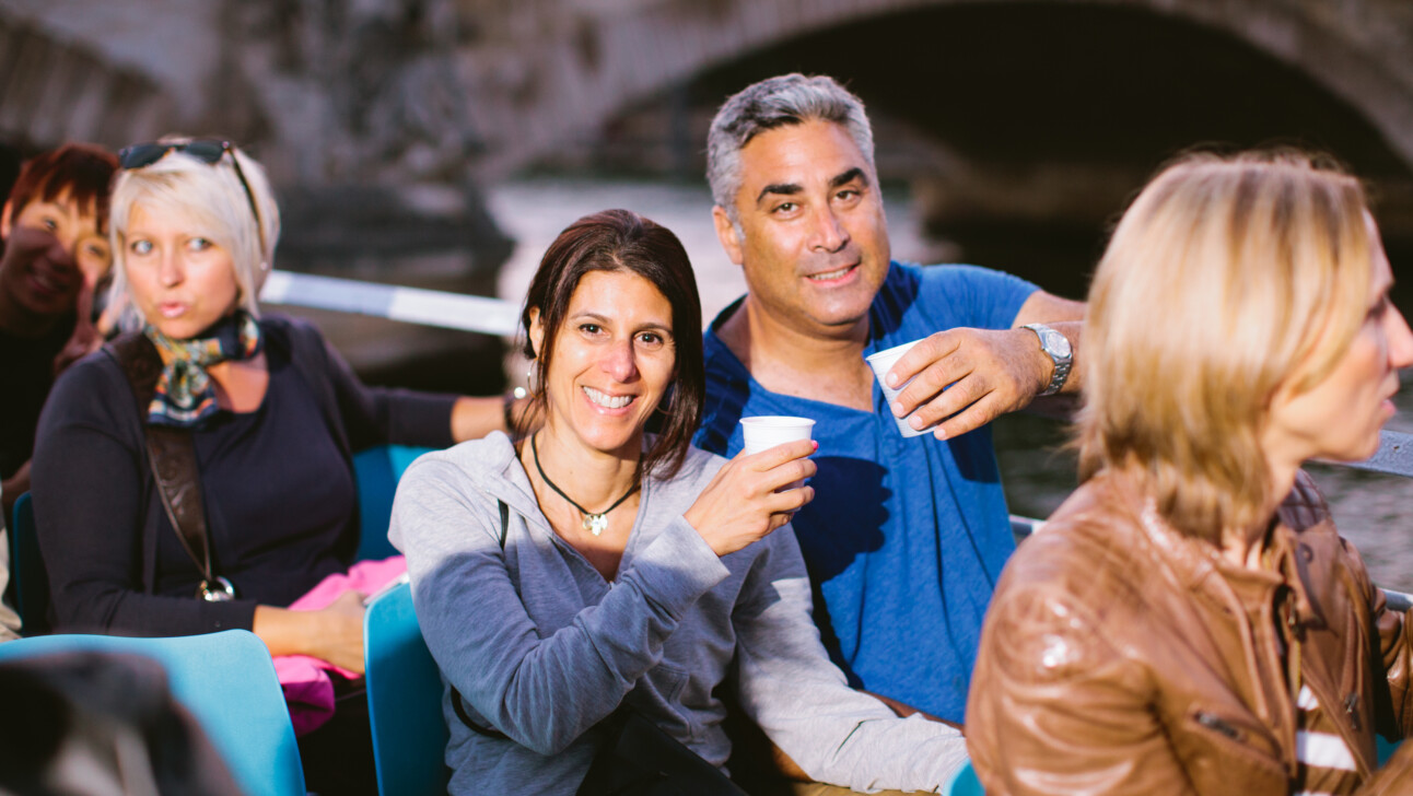 A couple enjoying a glass of wine in Paris, France